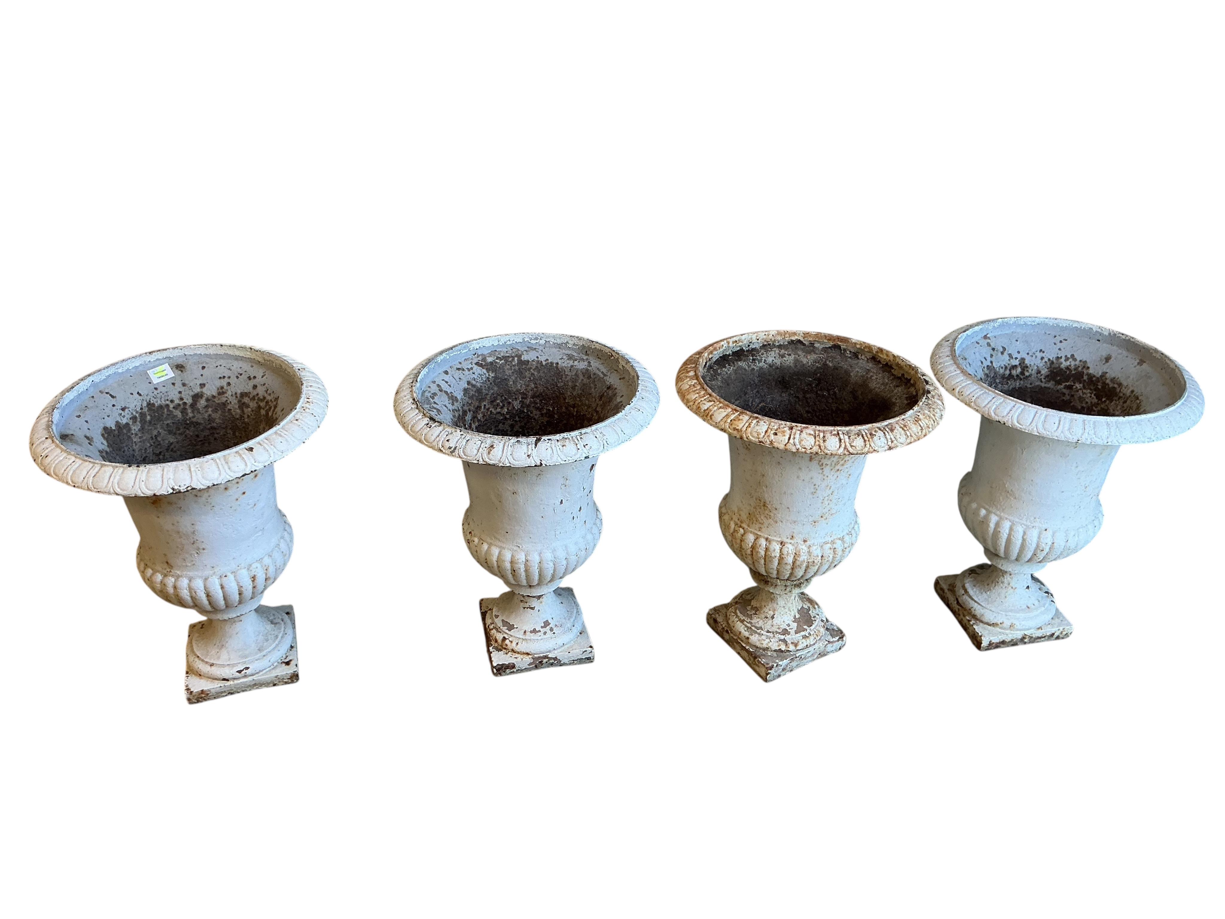 Four Victorian white painted cast iron campana garden urns, diameter 50cm, height 64cm